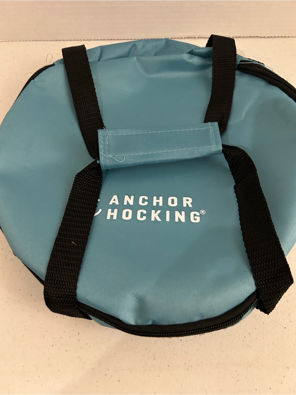 Anchor Hocking Teal round carry bag for pie or casserole.